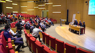 Baku form - group of people listening to a speaker